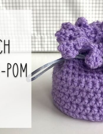 crochet mini pouch with pom-pom edging